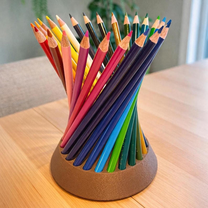 ColorWheel spinning colored pencil holder with pencils arranged in a spiral on a rotating base